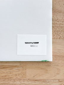 Back label of TAROART by TAROUT 00028 showing the serial number on the reverse side of the artwork