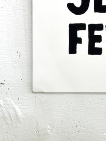 Close-up of the black message lettering and white illustration-board edge of TAROART by TAROUT 00029