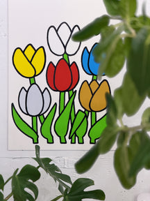 WELCOME, TAROART by TAROUT 00054, displayed on a white wall beside a green plant