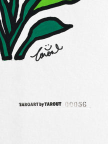 Close-up of the TAROUT signature and serial number 00056 on Strelitzia nicolai