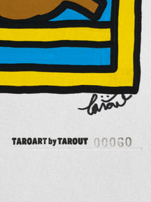 Close-up of the TAROUT signature and serial number 00060 on An Unexpected Visitor