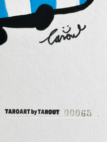 Close-up of the TAROUT signature and serial number 00065 on LUNNY Goes Swimming