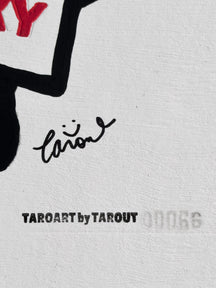 Close-up of the TAROUT signature and serial number 00066 on LUNNY and the T-Shirt