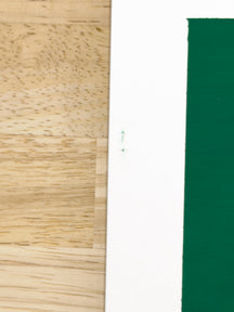 Close-up of green paint marks on the white edge of the illustration board in ONE FOR YOU, TAROART by TAROUT 00073