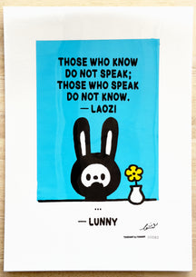 TAROART by TAROUT 00082, …: LUNNY with a closed mouth beside a yellow flower in a white vase on a blue background. Actual artwork photographed with its printed transparent sheet in place: “THOSE WHO KNOW DO NOT SPEAK; THOSE WHO SPEAK DO NOT KNOW.” — Laozi; LUNNY replies “...”.
