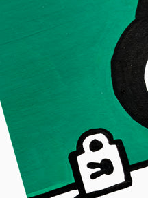 TAROART by TAROUT 00083, I DON'T THINK, BUT I AM.: close-up of an angled view of the green paint, black outline and small white tag-shaped motif.